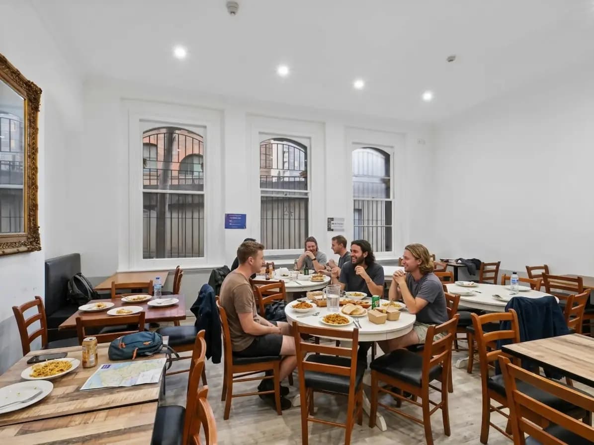 Travellers sharing dinner in Sydney long-stay accommodation